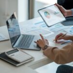 What makes a good ESOS action plan? A person sits at a desk with their laptop, working on an ESOS action plan.