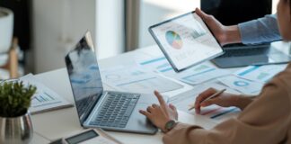 What makes a good ESOS action plan? A person sits at a desk with their laptop, working on an ESOS action plan.