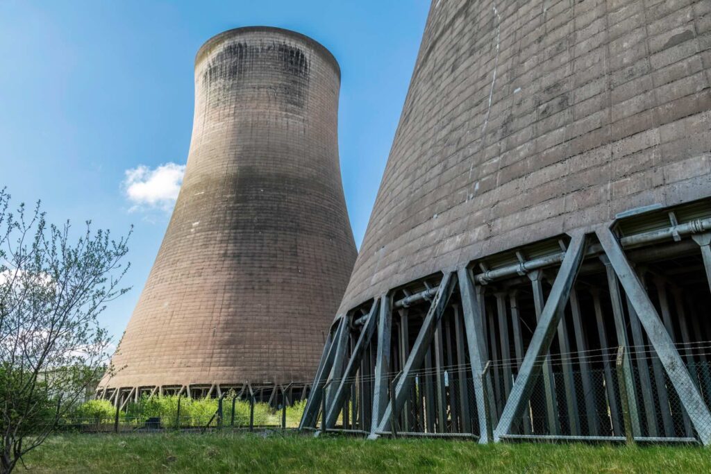 Looking up at two nuclear reactors from below. A plant in Cheshire will receive funding from the government.