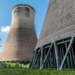UK rockets nuclear forward with £196m investment Looking up at two nuclear reactors from below. A plant in Cheshire will receive funding from the government.