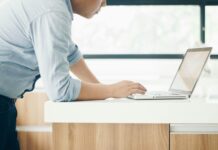 EA softens position on ESOS enforcement due to IT portal issues A mean leans over his laptop, looking focused as he tried to access the ESOS IT portal