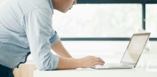 EA softens position on ESOS enforcement due to IT portal issues A mean leans over his laptop, looking focused as he tried to access the ESOS IT portal