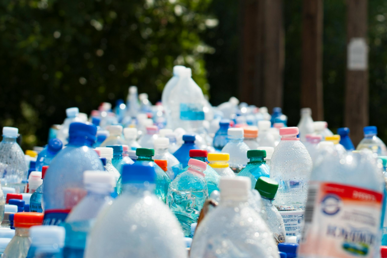 A large pile of bottles is waiting to be collected by waste management, which may see changes due to the new UK Emissions Trading Scheme changes