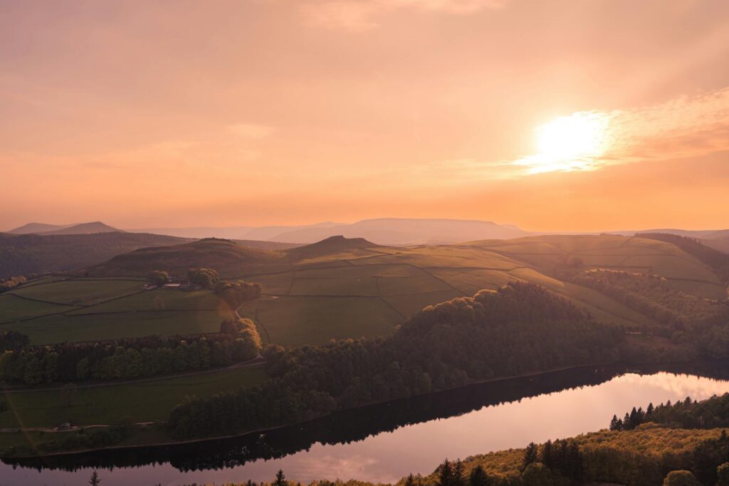 Rolling green hills in England reflect the afternoon light in England which, according to a new report from the Climate Change Committee, is not on track to meet its net zero goals