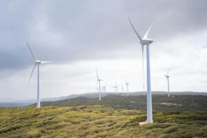 Wind turbines blend in against a bright grey sky as the Welsh Government launches publicly-owned renewable energy developer