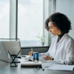 Environment Agency confirms enforcement approach for ESOS Action Plans A woman sits at her desk with her laptop while working on her ESOS Action Plan in time for the 5 March 2024 deadline