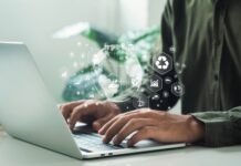 UK government to launch consultation on Sustainability Reporting Standards A man works on his laptop, looking at consultation on Sustainability Reporting Standards