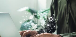 UK government to launch consultation on Sustainability Reporting Standards A man works on his laptop, looking at consultation on Sustainability Reporting Standards