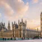 UK government relaunches Net Zero Council to support green transition Big Ben and parliament from across the street as the sun sets behind
