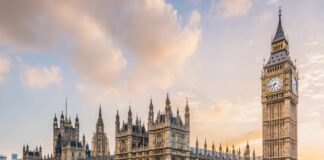 UK government relaunches Net Zero Council to support green transition Big Ben and parliament from across the street as the sun sets behind