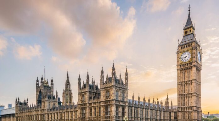 UK government relaunches Net Zero Council to support green transition Big Ben and parliament from across the street as the sun sets behind