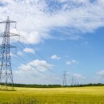 UK Industrial Strategy targets cheaper energy, faster grid access, and green growth Scenic View of Power Lines in English Countryside