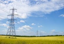 UK Industrial Strategy targets cheaper energy, faster grid access, and green growth Scenic View of Power Lines in English Countryside