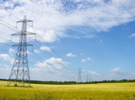 UK Industrial Strategy targets cheaper energy, faster grid access, and green growth Scenic View of Power Lines in English Countryside