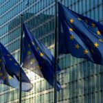 EU simplifies Sustainability Taxonomy as part of Omnibus I reforms Three European flags hanging on poles