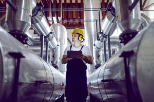 technician with large pipes network