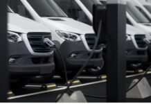 Government extends electric van and truck grants to 2027 A row of commercial electric vans are charging