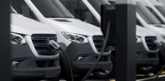 Government extends electric van and truck grants to 2027 A row of commercial electric vans are charging