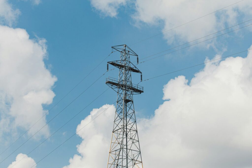 UK energy pylon and blue sky background