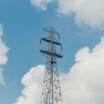 TNUoS charges set to rise higher than previously forecast UK energy pylon and blue sky background