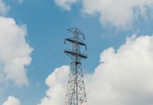 TNUoS charges set to rise higher than previously forecast UK energy pylon and blue sky background