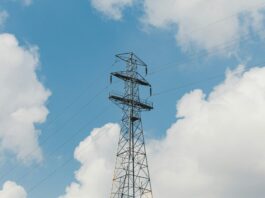 TNUoS charges set to rise higher than previously forecast UK energy pylon and blue sky background